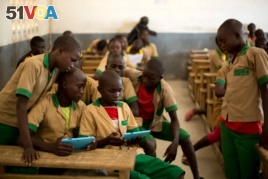Students learn with the help of a computer tablet provided by UNICEF at a school in Baigai, northern Cameroon, Tuesday 31 October 2017. UNICEF initiated a pilot project in January 2017 called ‘Connect My School'.