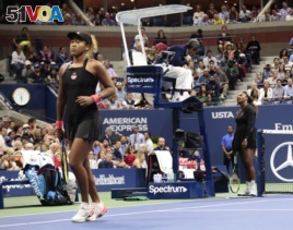Serena Williams talks with chair umpire Carlos Ramos during a match against Naomi Osaka, of Japan, in the women's final of the U.S. Open tennis tournament, Saturday, Sept. 8, 2018, in New York. (AP Photo/Andres Kudacki)