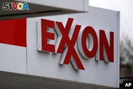 This April 29, 2014 photo shows an Exxon sign at a Exxon gas station in Carnegie, Pennsylvania.  (AP/Gene J. Puskar)
