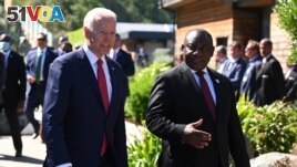 FILE - U.S. President Joe Biden with South Africa's President Cyril Ramaphosa at G7 meeting in Carbis Bay, Cornwall, Britain, June 12, 2021. (Leon Neal/Pool via REUTERS)