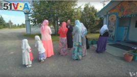 Members of the Old Believers community, wearing traditional clothes, in Nikolaevsk, Alaska.