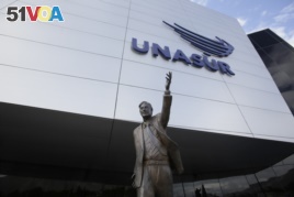 The statue of former Argentinian President Nestor Kirchner stands at the entrance to the Union of South American Nations, UNASUR, building, near Quito, Ecuador, Dec. 19, 2018. (AP Photo/Dolores Ochoa)