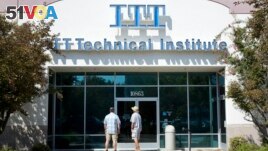 FILE - Students find the doors locked to the ITT Technical Institute campus in Rancho Cordova, Calif. The U.S. Education Department says it's erasing student debt for thousands of borrowers who attended a for-profit college chain that made exaggerated cla