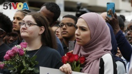 Mourners listen to speakers June 21, 2017, in Reston, Va., during a vigil in honor of Nabra Hassanen. Islamic leaders say the beating death of Nabar looks all too much like a hate crime.