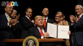 U.S. President Donald Trump is applauded after signing an Executive Order on US-Cuba policy in Miami, Florida, U.S. (File)