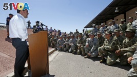 Arizona Republican Gov. Doug Ducey speaks to Arizona National Guard soldiers prior to deployment to the Mexico border at the Papago Park Military Reservation in Phoenix, April 9, 2018.
