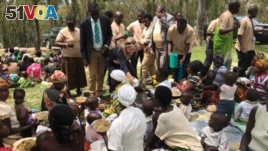 U.S. Ambassador to Rwanda Erica J. Barks-Ruggles and Rwandan citizens. 