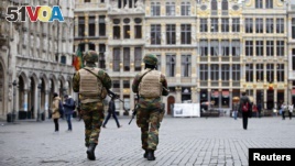 Belgian soldiers patrol in the Grand Place of Brussels following Tuesday's bombings in Brussels , Belgium, March 24, 2016.    