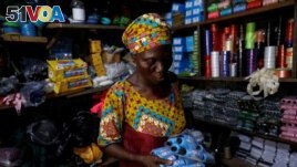 hade Ajayi, 50, shops for thread for her bag-making business, at a store in Ilorin, Kwara state, March, 26, 2021. REUTERS/Temilade Adelaja