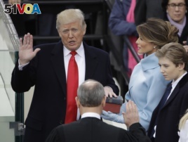 Donald Trump takes the oath of office.
