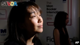 Winner of the 2016 Man Booker International prize for fiction Han Kang speaks to the media after winning the award for her book, 