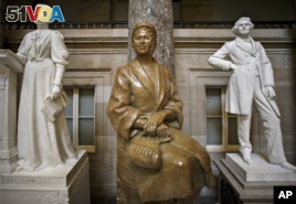 FILE - The statue of African-American civil rights activist Rosa Parks is seen in Statuary Hall on Capitol Hill in Washington, D.C., Dec. 1, 2014,