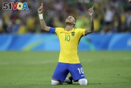 Brazil's Neymar cries as he celebrates after scoring the decisive penalty kick during the final match of the men's Olympic football tournament between Brazil and Germany at the Maracana stadium in Rio de Janeiro, Aug. 20, 2016.