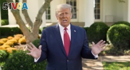 U.S. President Donald Trump makes an announcement about his treatment for coronavirus disease (COVID-19), in Washington, U.S., in this still image taken from video, October 7, 2020.