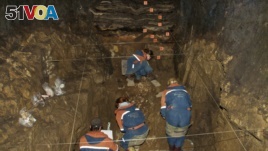 In this 2011 photo provided by Bence Viola of the University of Toronto, researchers excavate a cave for Denisovan fossils in the Altai Krai area of Russia. (Bence Viola/Department of Anthropology - University of Toronto/Max Planck Institute for Evolutionary Anthropology via AP)
