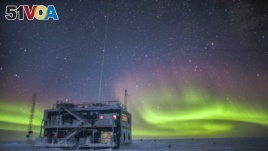 This undated photo provided by NOAA in May 2018 shows aurora australis near the South Pole Atmospheric Research Observatory in Antarctica. (Patrick Cullis/NOAA via AP)