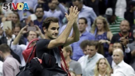 Roger Federer, of Switzerland, acknowledges spectators while leaving the court after losing to Juan Martin del Potro, of Argentina, during the quarterfinals of the U.S. Open tennis tournament, Wednesday, Sept. 6, 2017, in New York. (AP Photo/Julio Cortez)