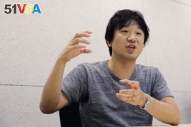 Japan Emoji creator Shigetaka Kurita speaks during an interview at his office in Tokyo.