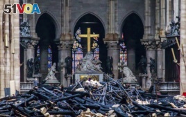 Debris are seen inside Notre Dame cathedral in Paris, April 16, 2019.
