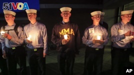 Maine Maritime Academy students attend a vigil of hope for the missing crew members of the U.S. container ship El Faro, Tuesday evening, Oct. 6, 2015.