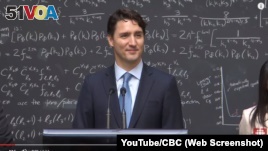 Canadian Prime Minister Justin Trudeau speaks with reporters about quantum computing during an event at a physics research lab in Ontario in April 2016.