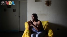 Luber Faneitte, a 56-year-old diagnosed with lung cancer, talks during a interview with AFP at her house in the San Agustin shantytown in Caracas on Nov. 10, 2017. Faneitte fears that if Venezuela defaults on its $150 billion debt, which is considered lik