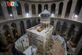 The renovated Edicule is seen in the Church of the Holy Sepulchre, traditionally believed to be the site of the crucifixion of Jesus Christ, in Jerusalem's old city Monday, Mar. 20, 2017.