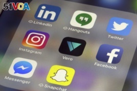 Various social media apps are displayed on an iPhone in New York, Thursday, March 1, 2018. (AP Photo/Richard Drew)