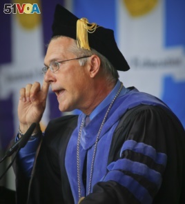 Dr. Vincent Boudreau, interim president for City College of New York (CCNY), speaks to graduates during a graduation ceremony for the division of Humanities and the Arts, Wednesday May 31, 2017, in New York.