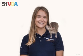 American researcher Ellie Cutright with an African giant pounched rat. She trains them to find underground explosives.