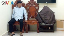 FILE - In this Feb. 1, 2018, file photo, former opposition leader Kem Sokha sits at the appeals court during the hearing of a bail application, in Phnom Penh, Cambodia.