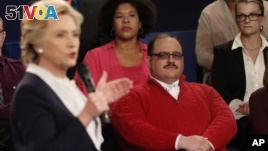 Kenneth Bone listens as Democratic presidential nominee Hillary Clinton answers a question during the second presidential debate with Republican presidential nominee Donald Trump at Washington University in St. Louis, Oct. 9, 2016.