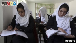 FILE - Girls are seen attending class at a school run by Aid Afghanistan for Education in Kabul May 13, 2014.