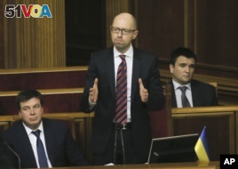 Ukrainian Prime Minister Arseniy Yatsenyuk reacts after surviving a vote of no confidence, in Parliament in Kyiv, Ukraine, Tuesday, Feb. 16, 2016.