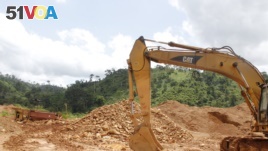 Excavators lie still at a small-scale gold mining site at the foot of the Atewa forest reserve in southeastern Ghana while government officials review the owners' paperwork, May 23, 2019.