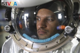 Analog astronaut Kartik Kumar wears an experimental space suit during a simulation of a future Mars mission in the Dhofar desert of southern Oman.