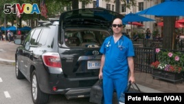 Dr. Ernest Brown works out of his black SUV. (Peter Musto/VOA)