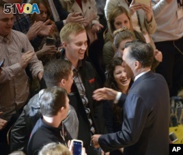 University of Utah students shake hands with former presidential candidate Mitt Romney after he made a speech criticizing Donald Trump  Thursday, March 3, 2016, in Salt Lake City. The 2012 GOP presidential nominee has been critical of front-runner Donald Trump on Twitter in recent weeks and has yet to endorse a candidates. (Al Hartmann/The Salt Lake Tribune via AP)