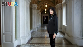 In this June 6, 2019 photo, Joy Harjo, of the United States, poses inside the Library of Congress, in Washington. Harjo has been named the country's next poet laureate, becoming the first Native American to hold that position. (Shawn Miller/Library of Congress)