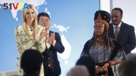 Ivanka Trump, left, the daughter and assistant to President Donald Trump, applauds after listening to a speech made by Francisca Awah Mbuli, right, from Cameroon and survivor of human trafficking, during an event to announce the 2018 Trafficking in Person