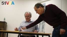 Theater director Nicholas Kent, right, and actor Peter Davison rehearse for the play 