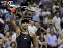 Naomi Osaka, of Japan, celebrates after defeating Madison Keys during the semifinals of the U.S. Open tennis tournament, Thursday, Sept. 6, 2018, in New York. (AP Photo/Seth Wenig)