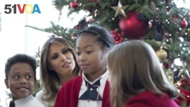 President Donald Trump's wife Melania spends time with young visitors to the White House.