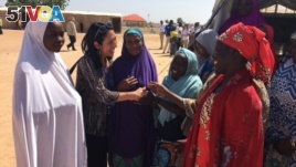 U.S. Deputy UN Ambassador Michelle Sisson talks to women in the Maiduguri camp. (M.Besheer/VOA)