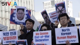FILE - South Korean protesters and North Korean defectors attend a rally urging the United States to discuss North Korean human rights issue in an upcoming meeting between Trump and Kim.