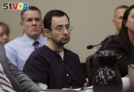 In this Jan. 24, 2018, file photo, Larry Nassar sits during his sentencing hearing in Lansing, Michigan.