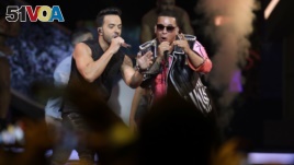 Singers Luis Fonsi, left and Daddy Yankee perform during the Latin Billboard Awards, April 27, 2017 in Coral Gables, Fla.