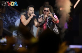 Singers Luis Fonsi, left and Daddy Yankee perform during the Latin Billboard Awards, April 27, 2017 in Coral Gables, Florida.