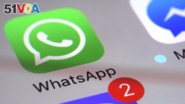 WhatsApp appears on a smartphone, March 10, 2017, in New York.