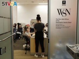 In this this, Sunday, April 22, 2018 photo, while pushing up against a deadline, students collaborate to put out the upcoming edition of the Washington Square News, New York University's independent, student-run, newspaper in New York.